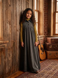 Gray sleeveless maxi dress for kids features button placket, pointy collar, tweed back insert and curve cut ruffled inverted empire waist.