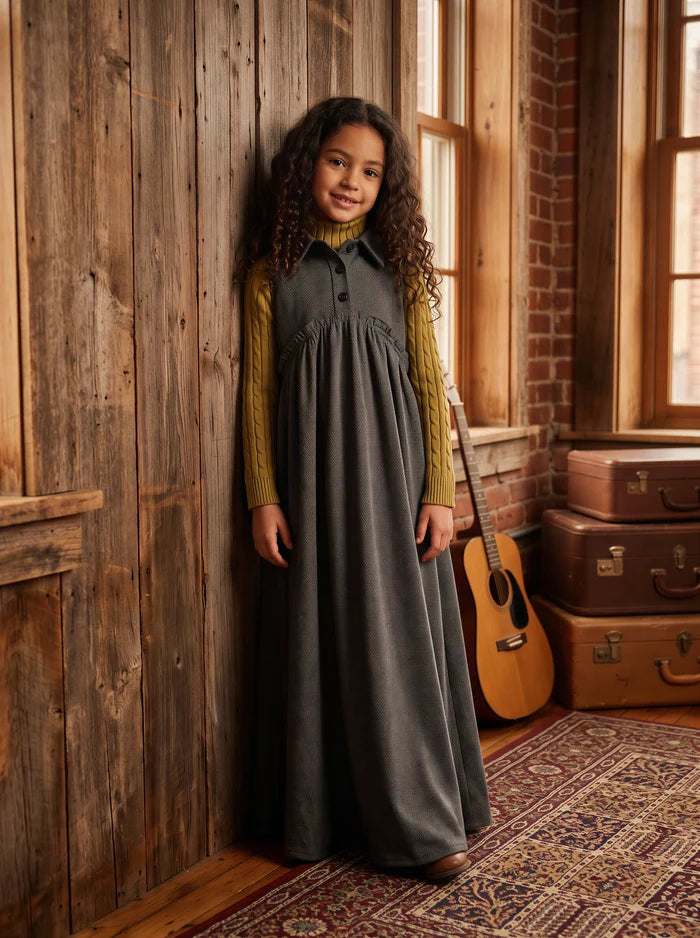 Gray sleeveless maxi dress for kids features button placket, pointy collar, tweed back insert and curve cut ruffled inverted empire waist.