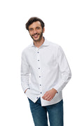 Man wearing a white dress shirt and blue jeans on a white background