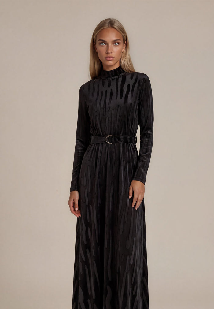 Black long-sleeve maxi dress with waist belt, gathered skirt and subtle vertical texture