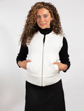 Ivory zip-front knit vest with stand collar and ribbed hem